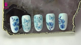 Flower and butterfly manicure in blue shade - Preview