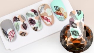 Colourful stamping manicure with vibrant patterns