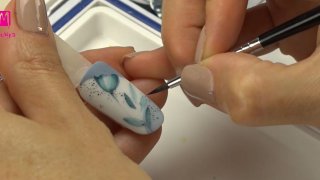 Spring nail art with blue flowers and bead