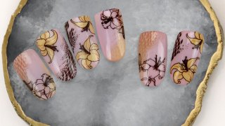 Nail art with lilies in autumn colours