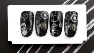 Black-silver manicure with effected stamping motif