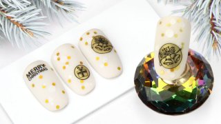 Christmas nail art with dots and small bells