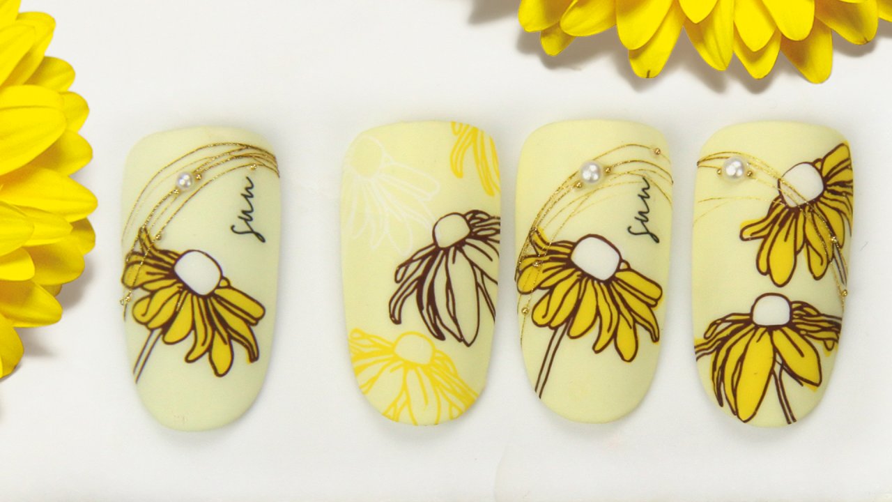 Floral nail art in sun yellow colours