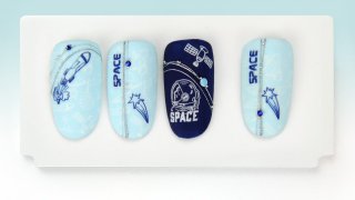 Layered stamping manicure with space motifs