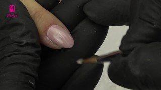 Gel polish nails in nude shades on coloured bases