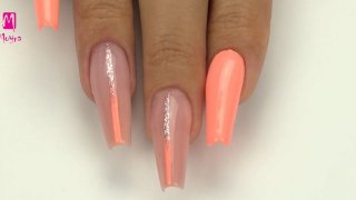 Ballerina-shaped nail sculpturing with trendy decoration in corall and glittering rose gold colours