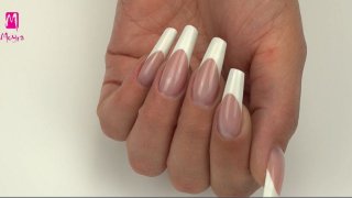 Classic white Marilyn-shaped French nail with filed smile line