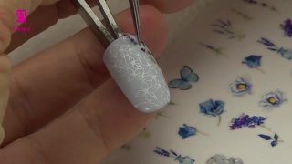 Easter nail art with stamped bunny and stickers