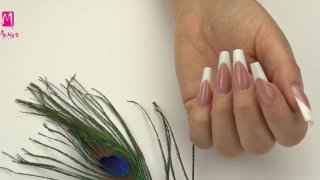 Classic white ballerina-shaped French nail with filed smile line, built with Moyra Fusion acrylgel