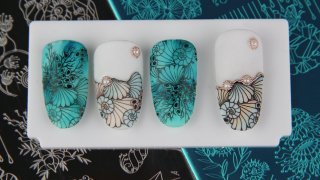 Aquarelle-painted, stamped nail art in summer mood