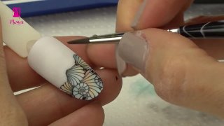 Aquarelle-painted, stamped nail art in summer mood