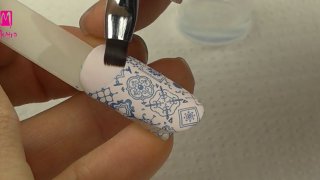 Nail art with Portuguese wall tile pattern