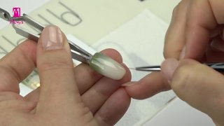 Christmas nail art on a nail foiled background