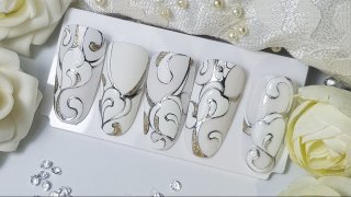 Romantic nail art in white and silver shades