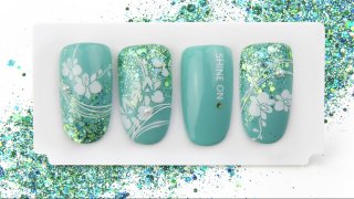 Turquoise nail art with orchid and shiny glitter