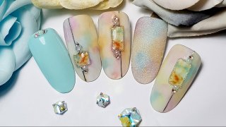 Marble nail art with beads in interesting colours