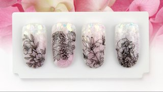 Floral nail art on glitter ombre base