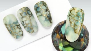 Effected stamped nail art on aquarelle base