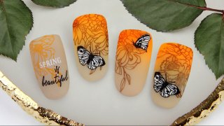 Colourful manicure with butterfly for spring