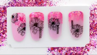 Floral nail art on magenta glitter ombre base