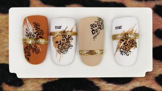 Trendy nail art with animal motif in clean colours
