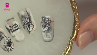 Floral and inscripted nail art idea on marble base - Preview