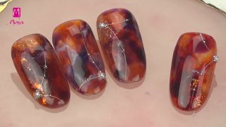 Red, marble nail art effected with nail foil - Preview