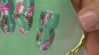 Hand-painted nail art with stamped leaves - Preview