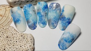 Nail decoration shining in blue and silver colours