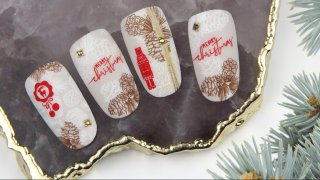 Layered stamping Christmas nail art with pine cone