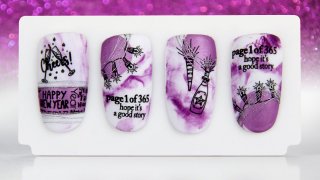 Nail art for New Year's Eve on purple marble base