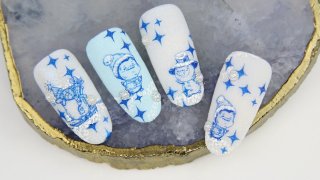 Cheerful winter nail art with snowman and penguin