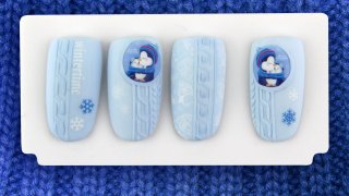 Cute penguin sticker nail art with knitted design