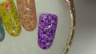 Elegant stamping nail art on a colourful base - Preview