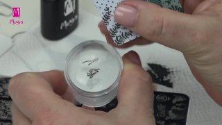 Nail art for Women's Day with flowers and stones