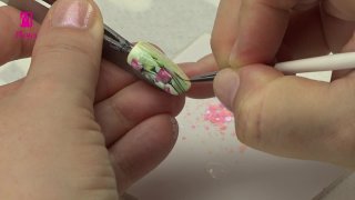 Colourful sticker nail art combined with glitter