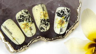 Stamping nail art with yellow flower sticker