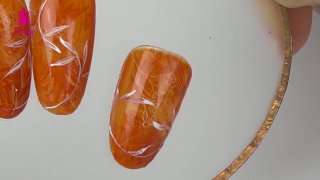 Layered stamping nail art in orange shade - Preview