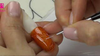 Layered stamping nail art in orange shade