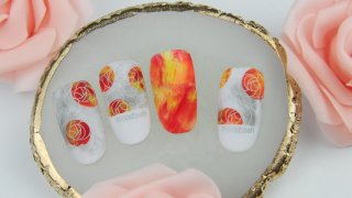 Rosy stamping nail art with colourful details