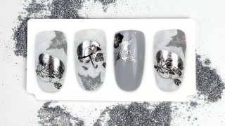 Monochrome nail art with autumn leaves