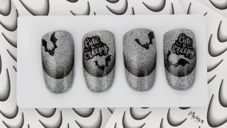 Halloween nail art on glittering silver base