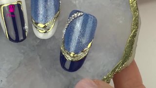 Foil nail art richly decorated with crystal stones  Preview