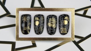 Black and gold nail art for Christmas