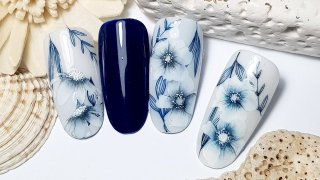 Hand-painted blue flowers on a stamped base