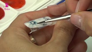 Hand-painted blue flowers on a stamped base