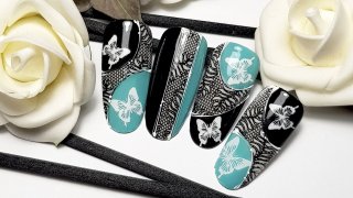 Butterfly nail art with lace motif
