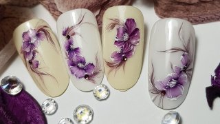 Purple floral nail art created with aquarelle