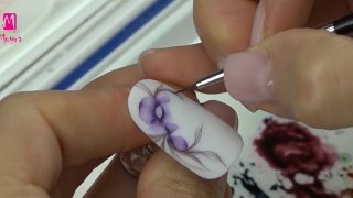Purple floral nail art created with aquarelle
