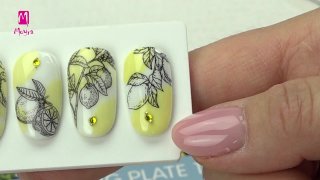 Stamping nail art with lemon on white-yellow base - Preview